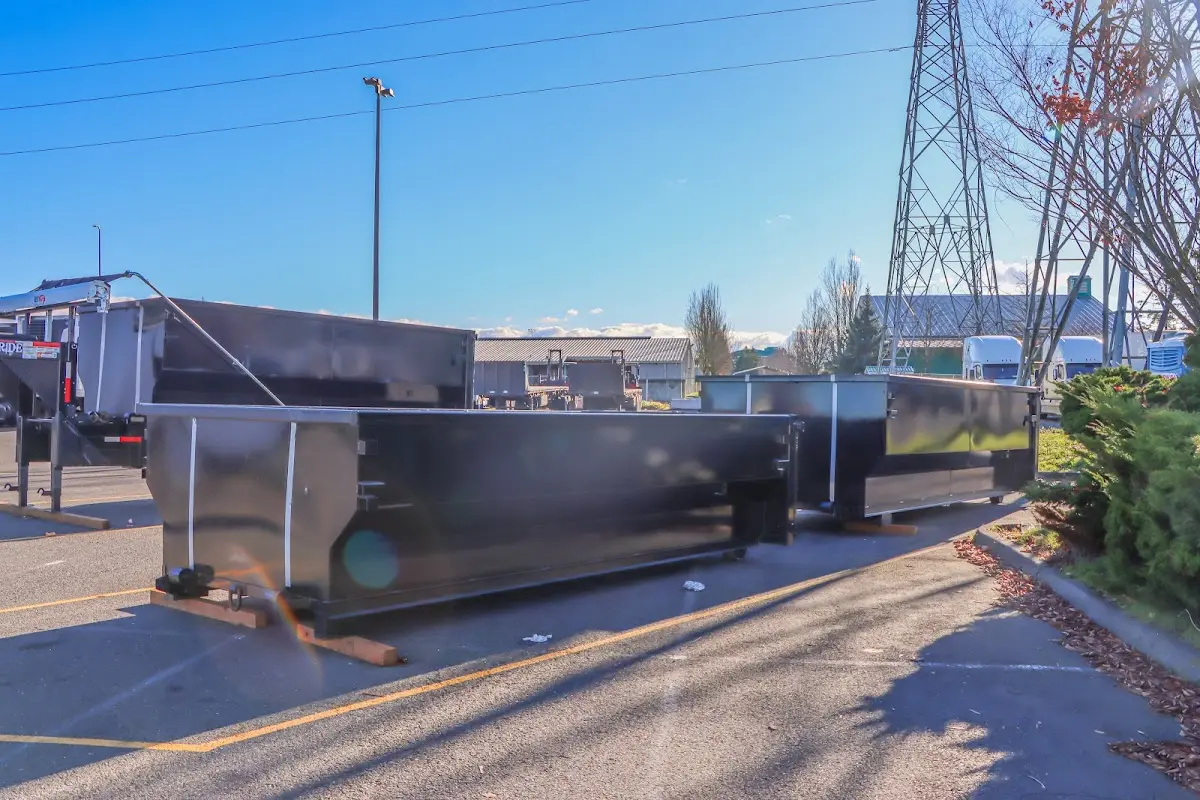 Roll-off dumpster ready for waste disposal at job site for 2 Yard Dumpster Rental in Zebulon